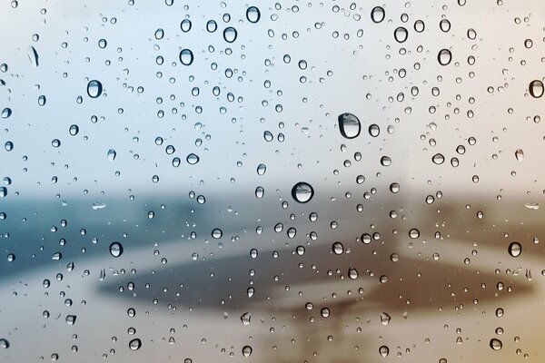 Beautiful rainy window with raindrops