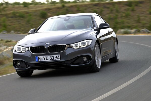 Luxury car rushes along the highway