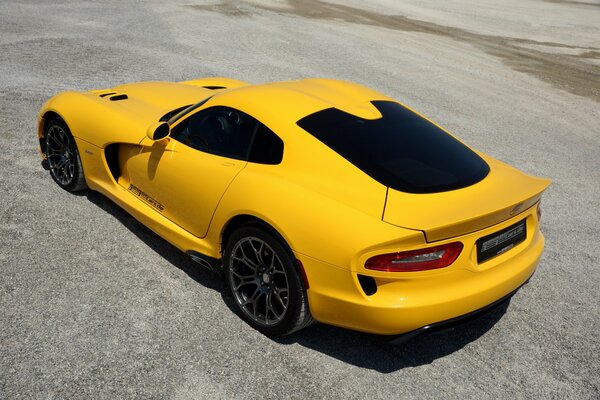 Yellow sports Dodge on the asphalt