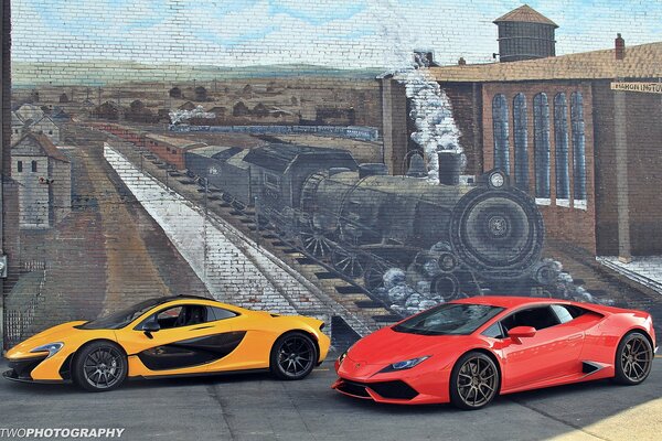 Mclaren p1 and lamborghini huracán on the background of a picture on the wall