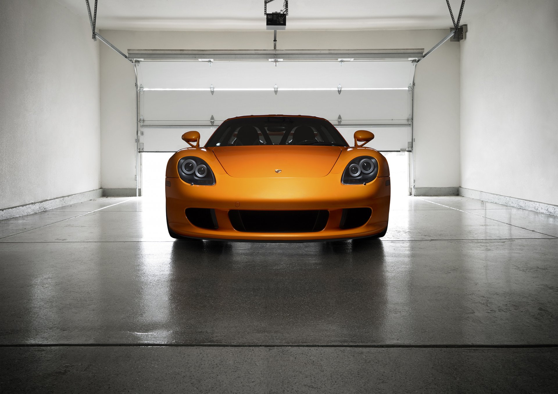 porsche carrera gt orange borealis exotic supercar light nigth front garage