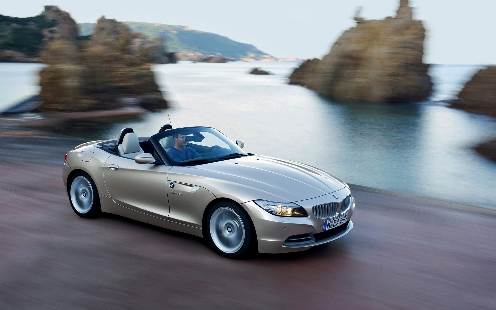 bmw z4 car convertible sea coast in motion rocks bmw