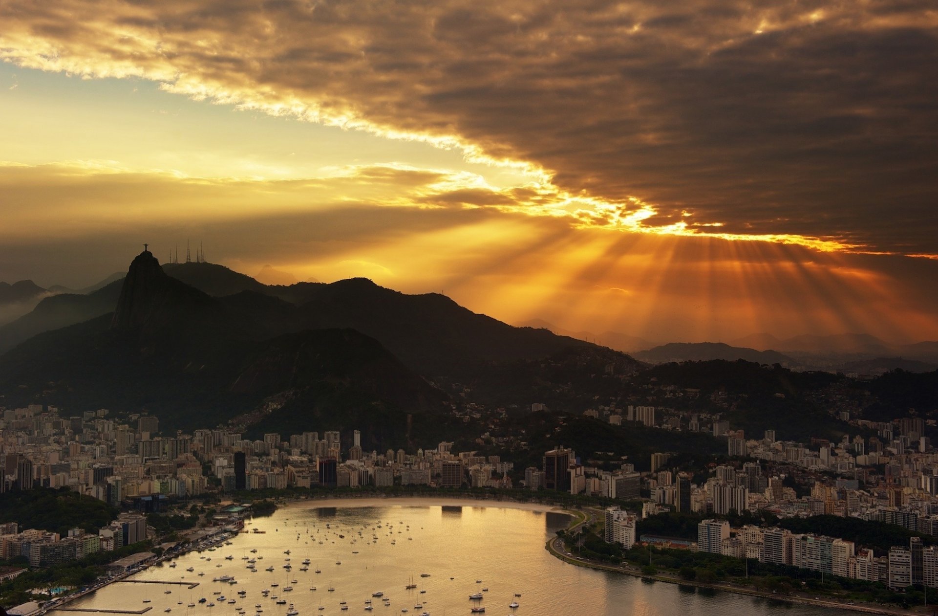 brazil rio de janeiro sunset the sky clouds skyscrapers the ocean boats city night