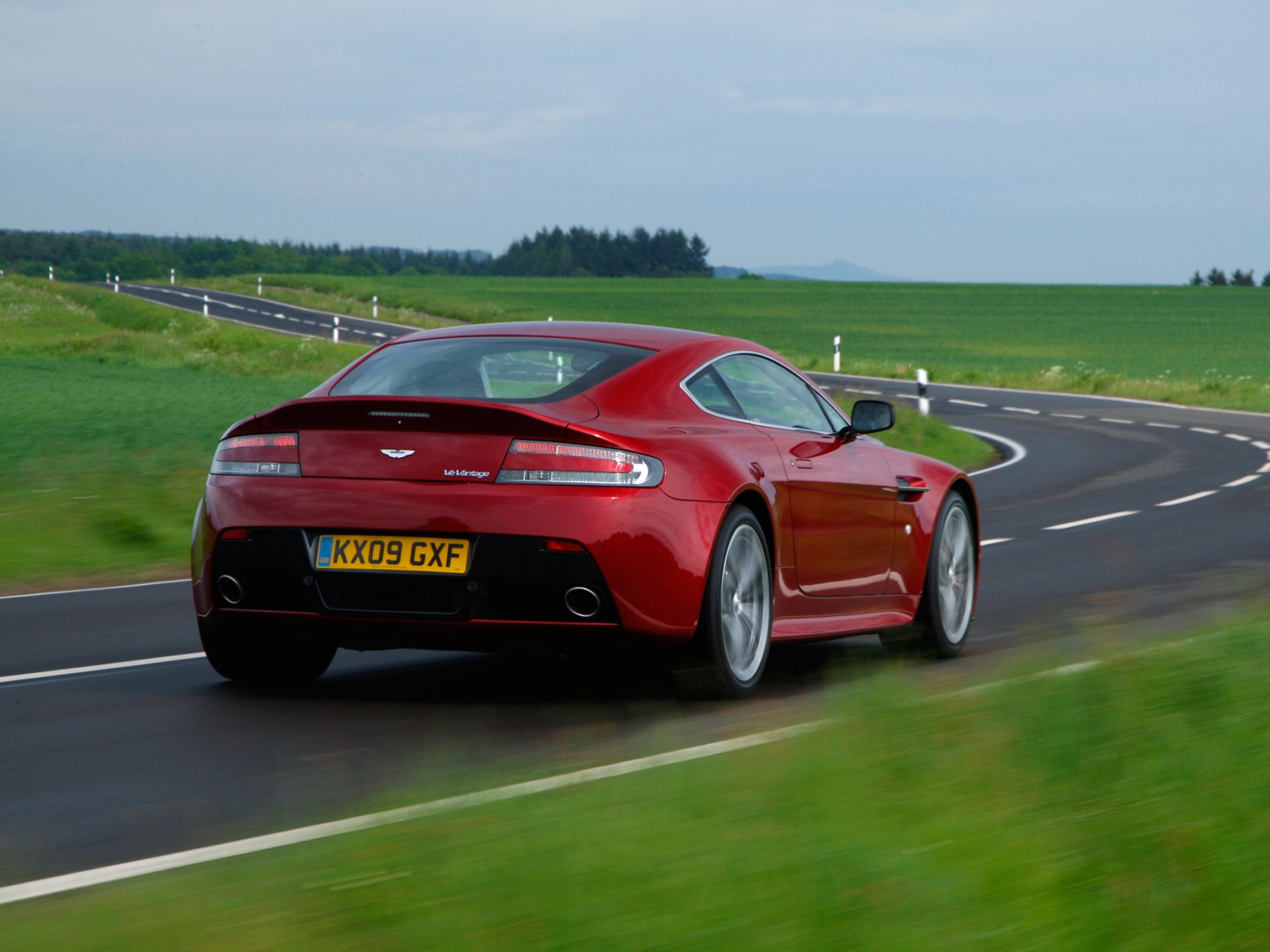 aston martin v12 vantage back of road car wallpaper