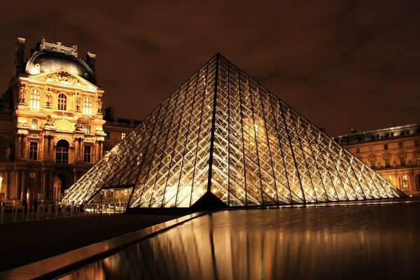 Illuminated museum in the form of a pyramid at night