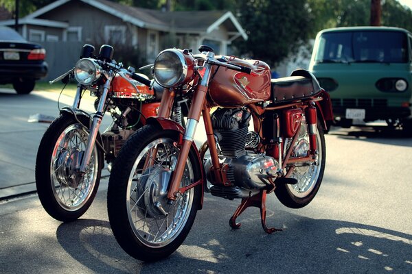 Two red parked retro bikes