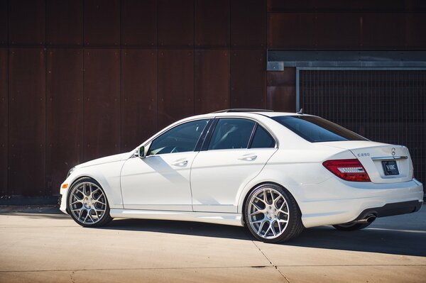 Mercedes C-class in white car