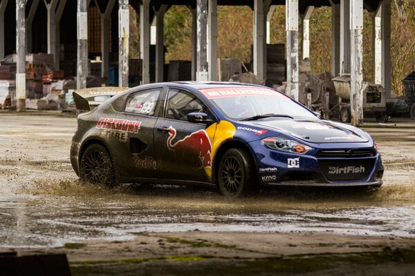 Photo of a car with a picture of a red bull