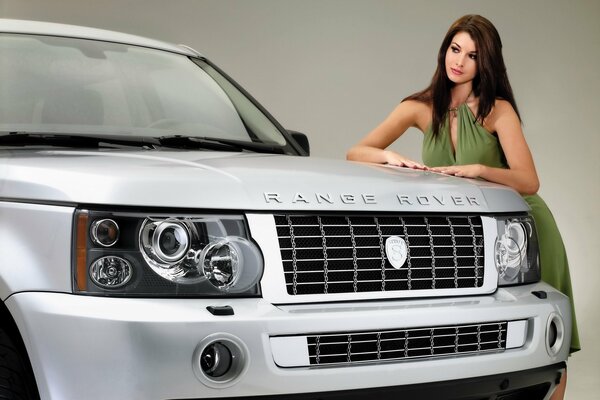 Land rover in front with a girl in the background