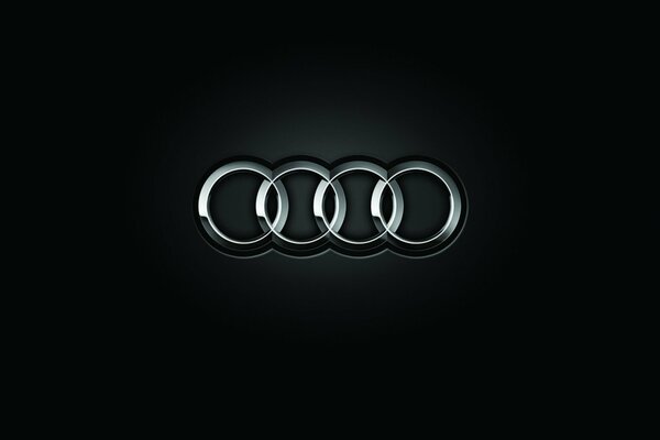 Audi-Emblem auf schwarzem Hintergrund