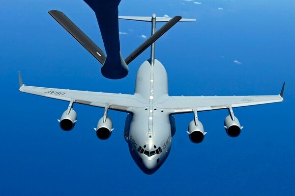 A jet plane on refueling in the sky