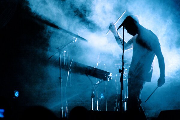 Performing on stage with smoke and music