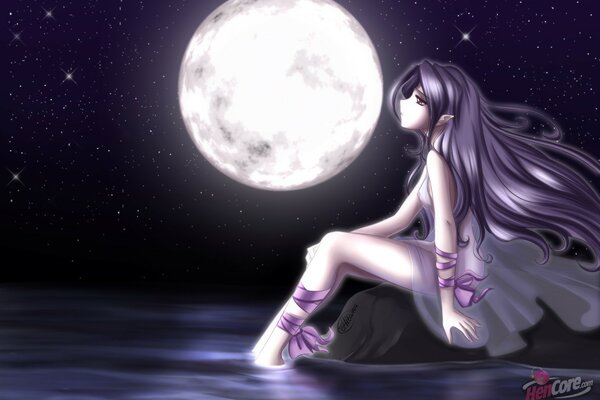 A girl under the night moon on the seashore