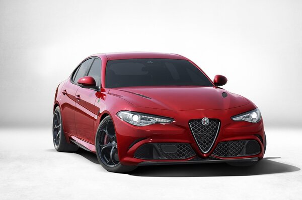 Alfaromeo Giulia rosso su sfondo grigio