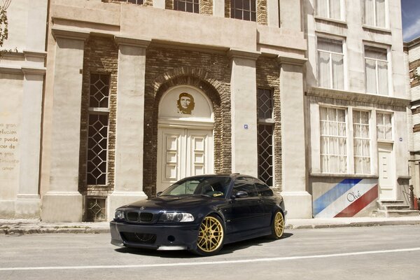 Bmw stands in front of the building