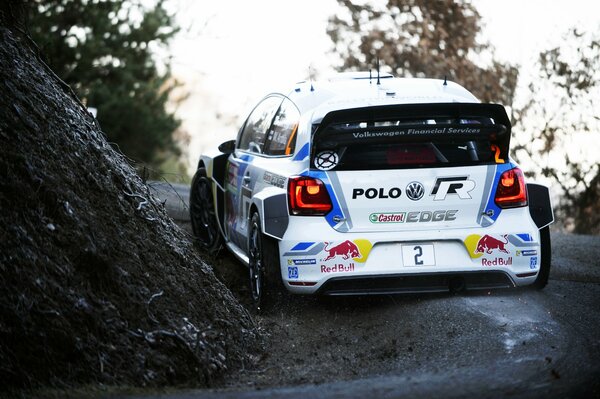 White Volkswagen at the turn of the rally