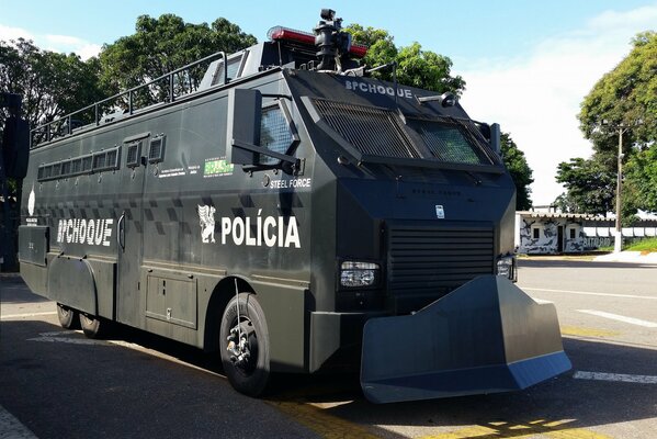 Police armored car with a blade in front