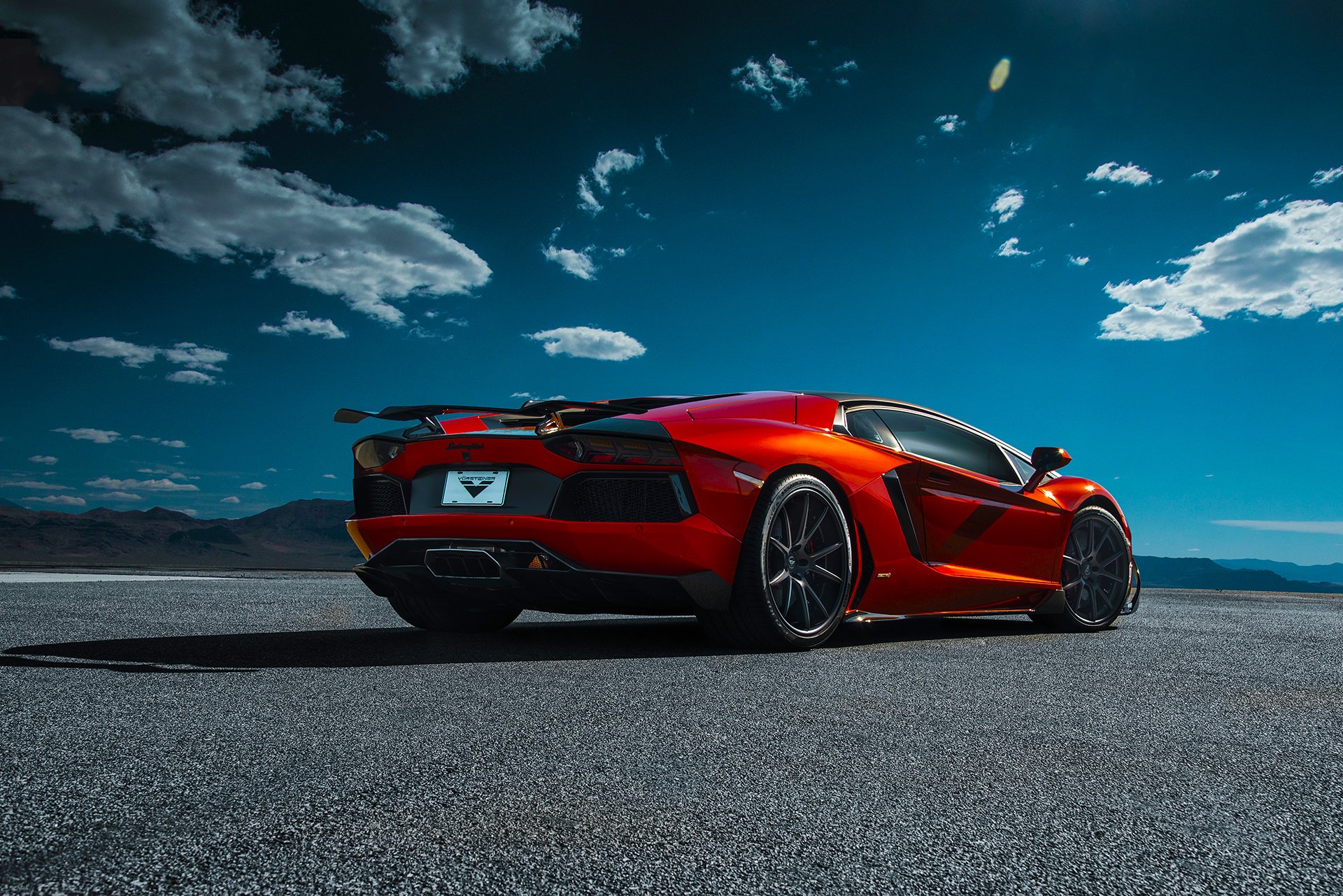 lamborghini aventador-v lp740-4 saragosse vorsteiner supercar orange arrière désert ciel nuages