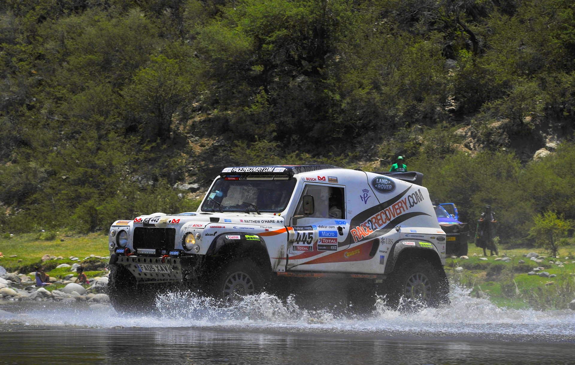 land rover defender suv dakar rally water spray white car sport