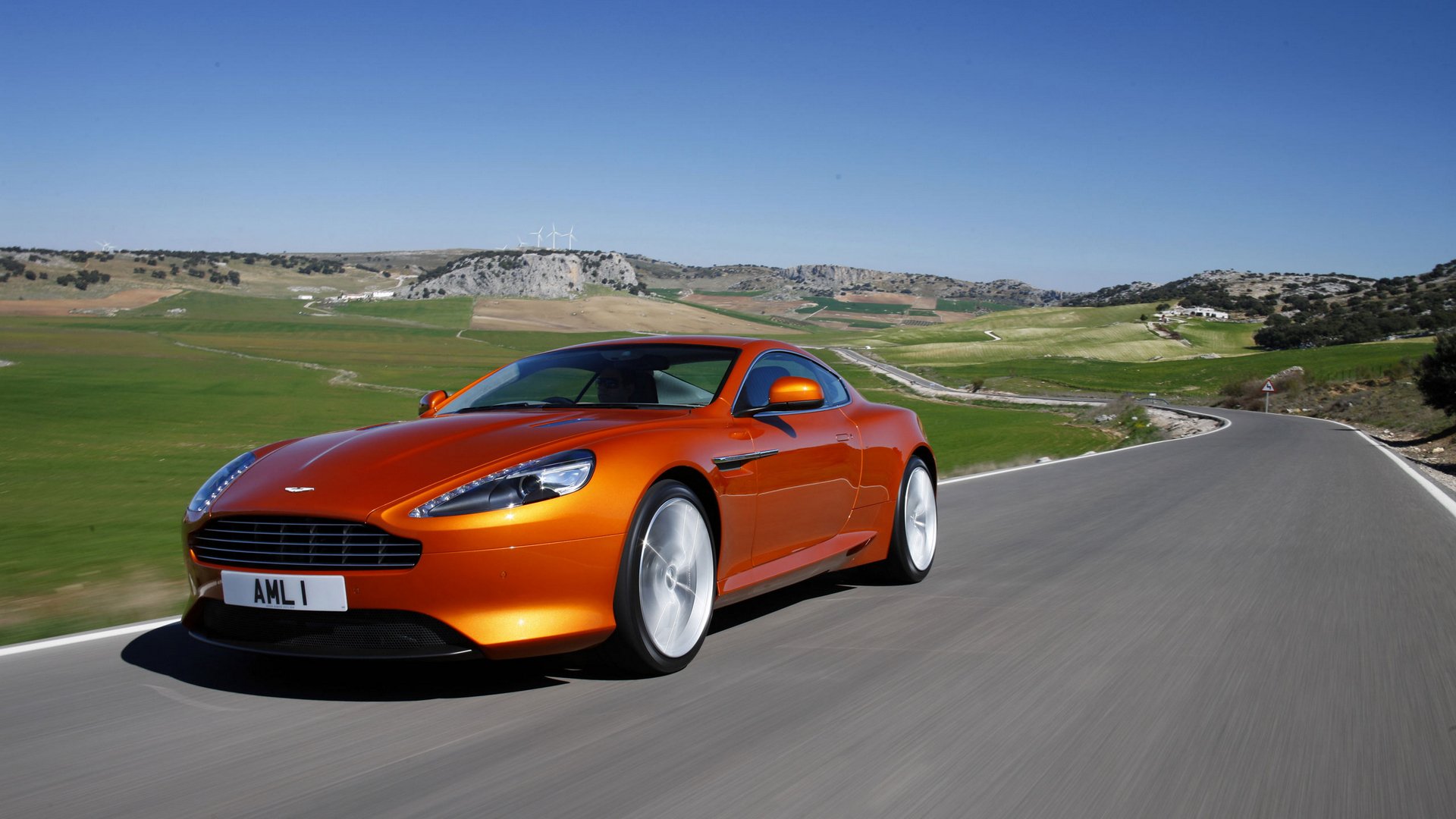 aston martin virage coupe landscape sky mountain road