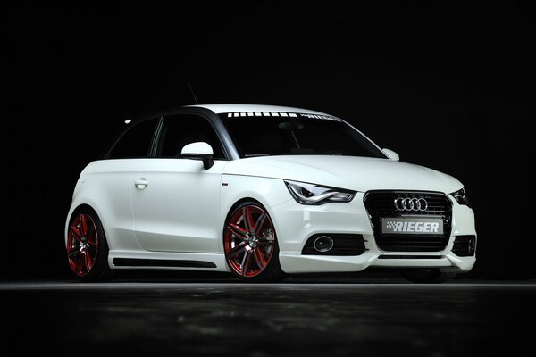 Luxury white Audi car on a black background