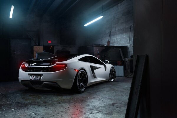 Tuning white McLaren in the factory shop