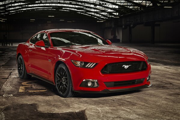 Red Ford Mustang car in the air garage