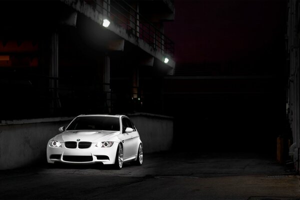 White fast car in an industrial area