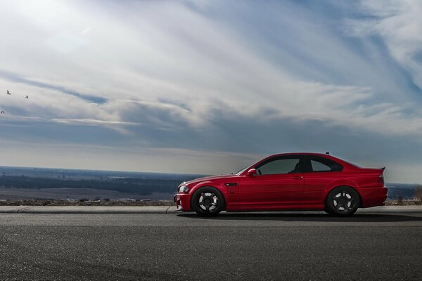 Red bmw, e46 side on the road