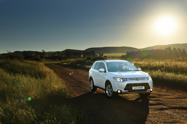 A white car on a field road