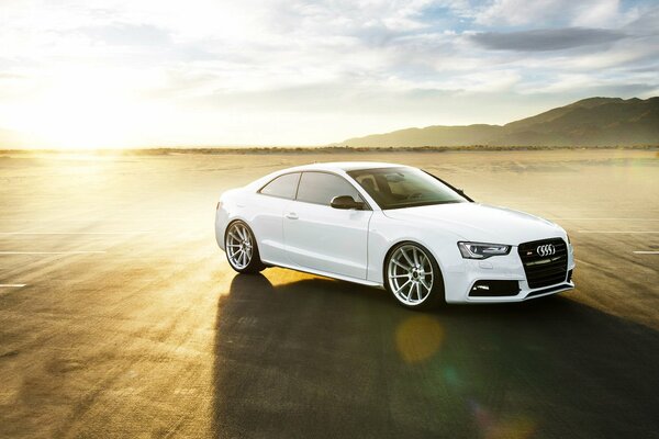 White audi s5 car in the desert