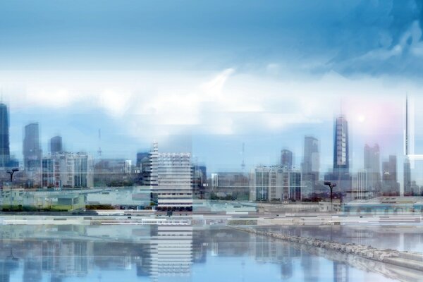 Foto tenue en los tonos azules de los rascacielos con vista al lago