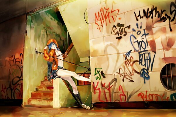 A girl with bare legs on the background of an entrance painted with inscriptions