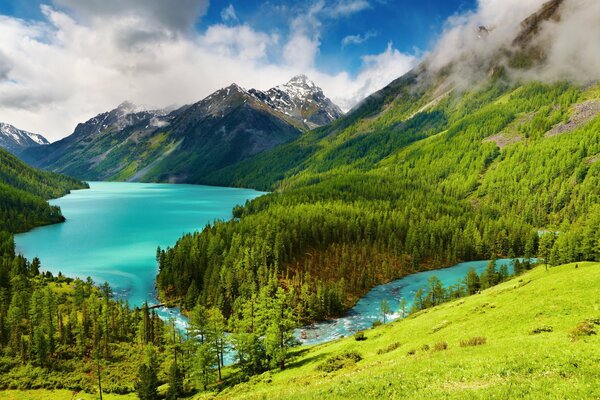 A bridge passed through a mountain lake with turquoise water to an incredibly beautiful place