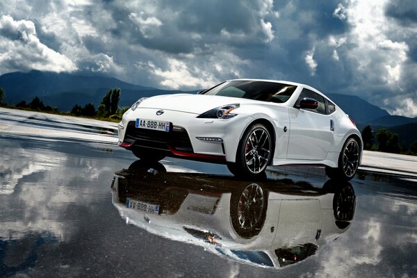 Nissan white stands on the outside and is reflected in it