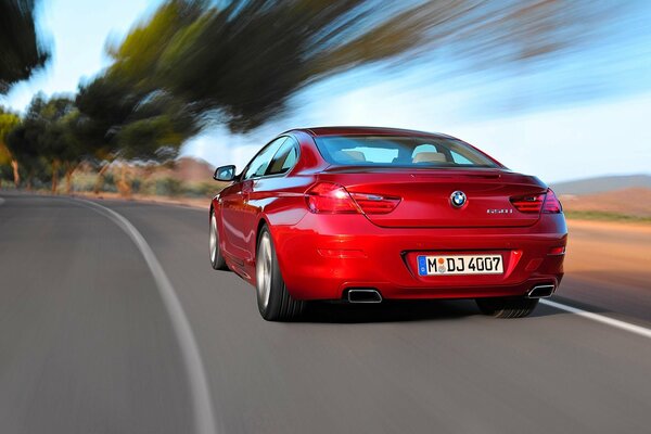 Red boomerang in motion on the road