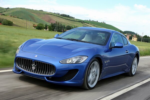 Blue Maserati granturismo at speed