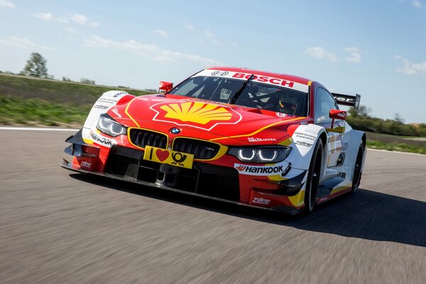 A sporty BMW is driving on the road