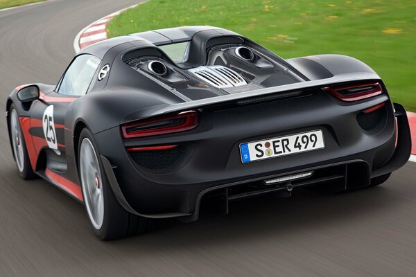 Black Porsche Spider takes a turn on the race track