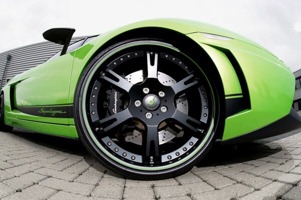 Green lamborghini car with black wheels