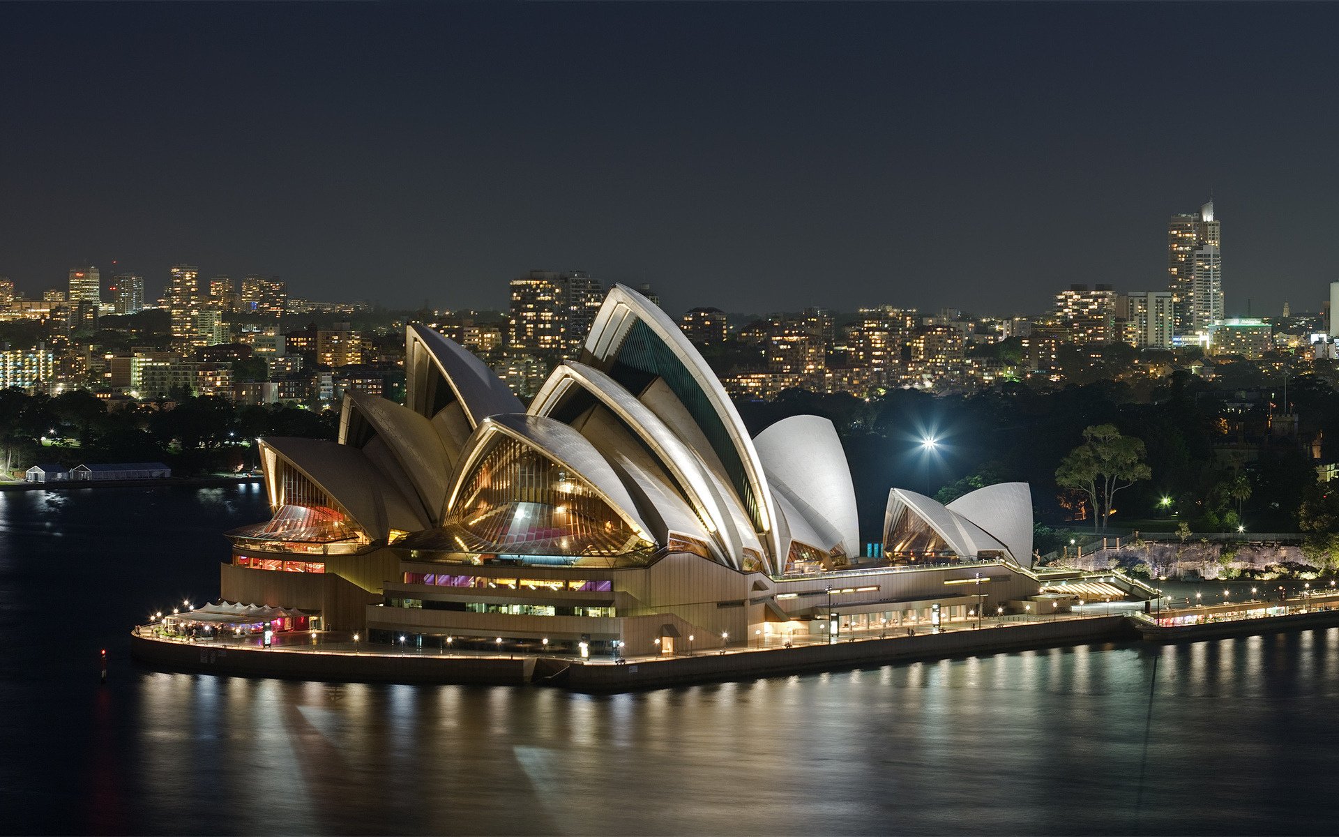 australia opera the evening water the city building architecture of sidney river background new york the ocean promenade lights the night sky night the lights of the city