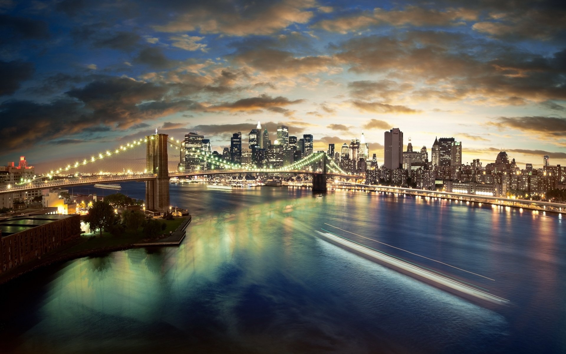 the city bridge lights the sky skyscrapers clouds reflection river new york background sunset water the night sky night the lights of the city