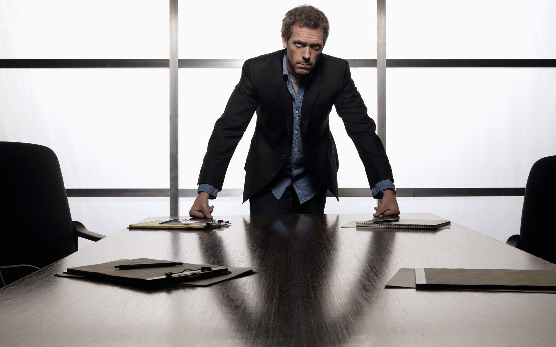 hugh laurie hugh laurie desk view folders office windows face