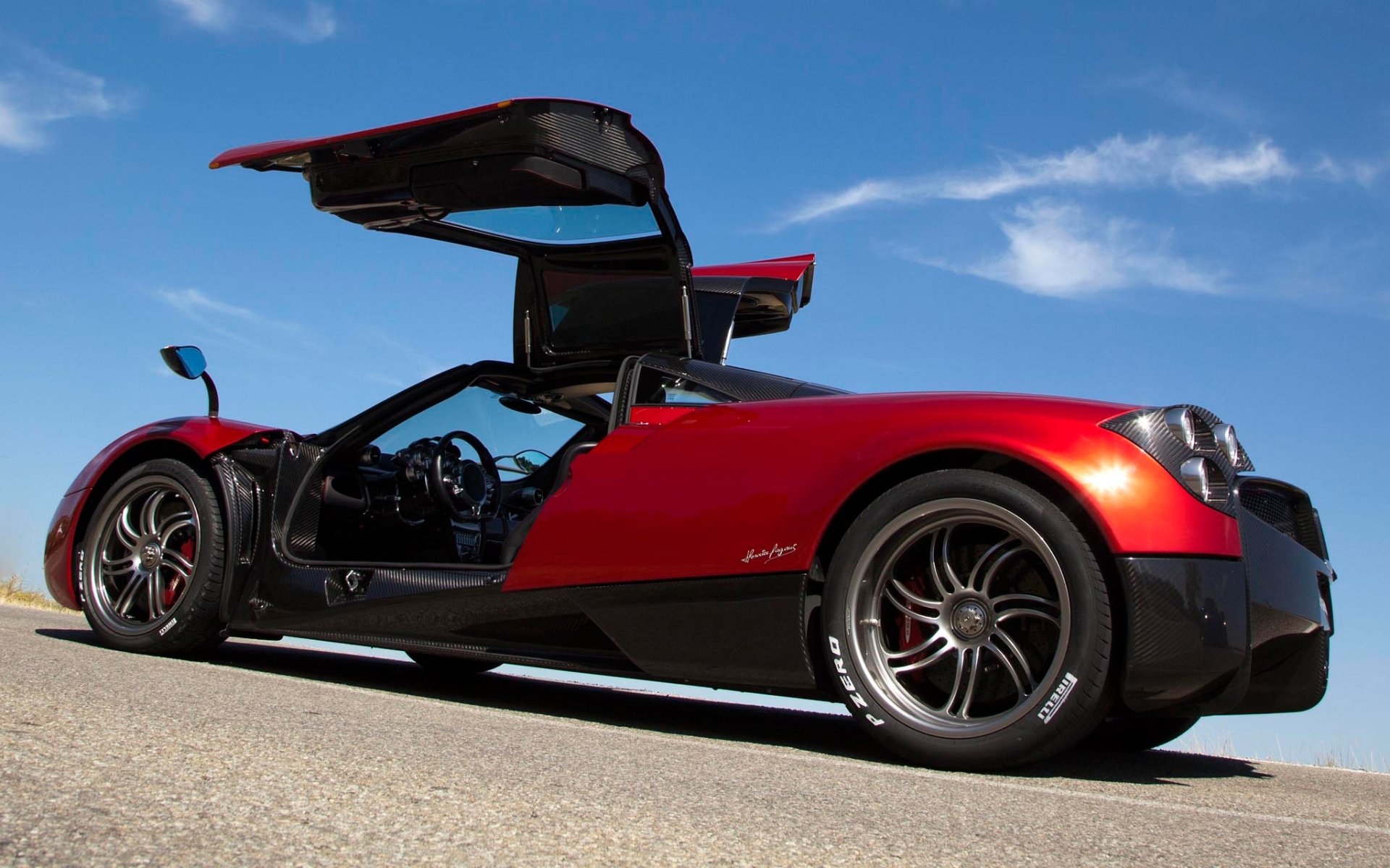 pagani huayra pagani huira supercar rosso vista posteriore porte cielo