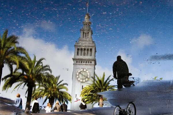 Reflection of the tower in a puddle