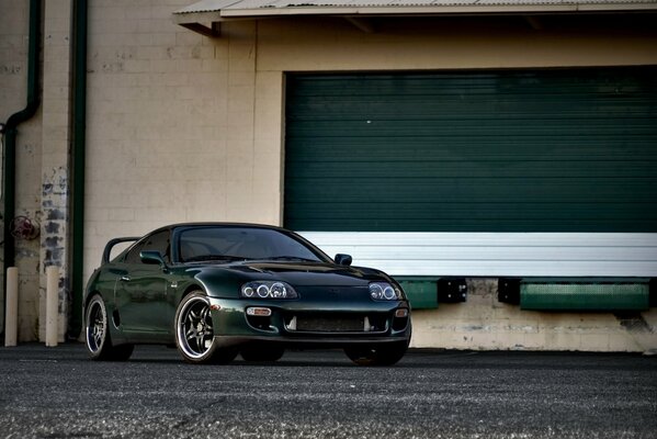 Green toyota supra green garage door