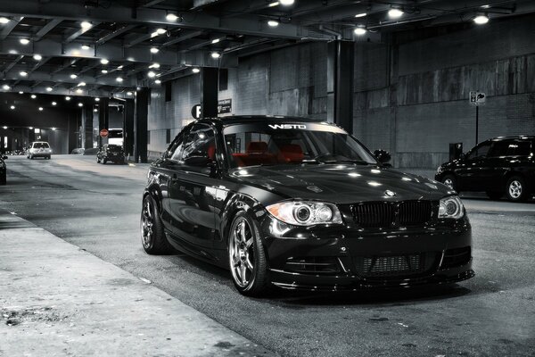 Black BMW car in the night garage