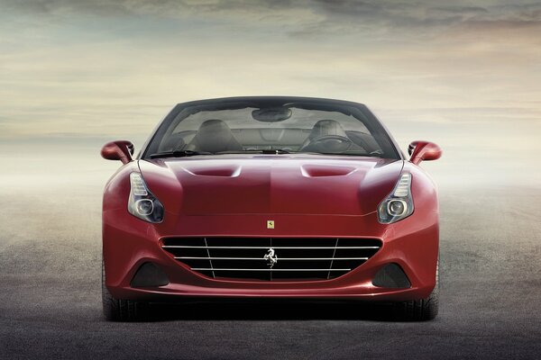 Ein Bild von einem roten Ferrari und Wolken