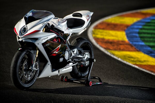 Sporty white motorcycle on the track