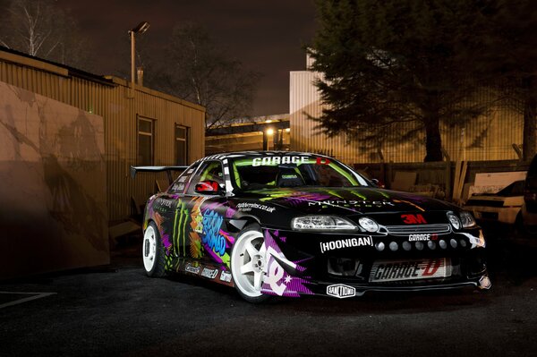At night, a Toyota car with spectacular tuning